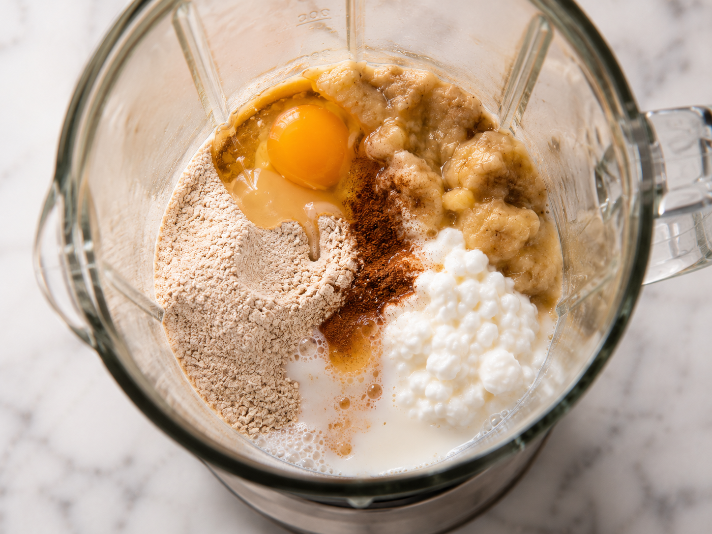 All pancake ingredients added to the blender with the oat flour — ready to blend