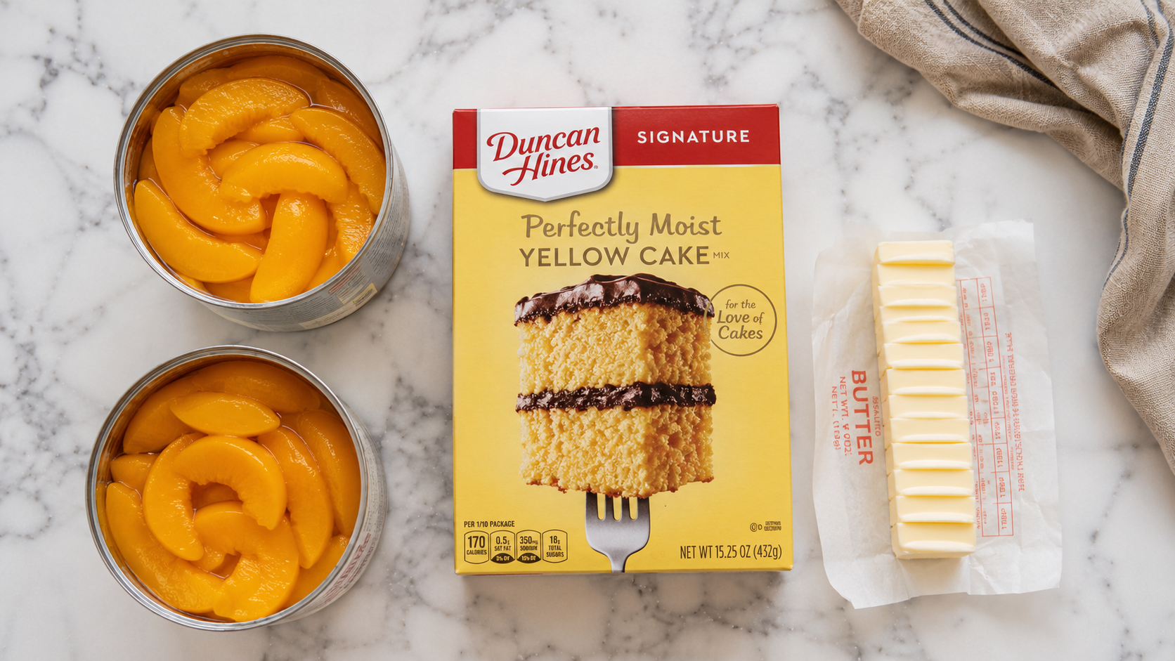 Three ingredients laid out — two large cans of peaches, a box of yellow cake mix and a stick of butter