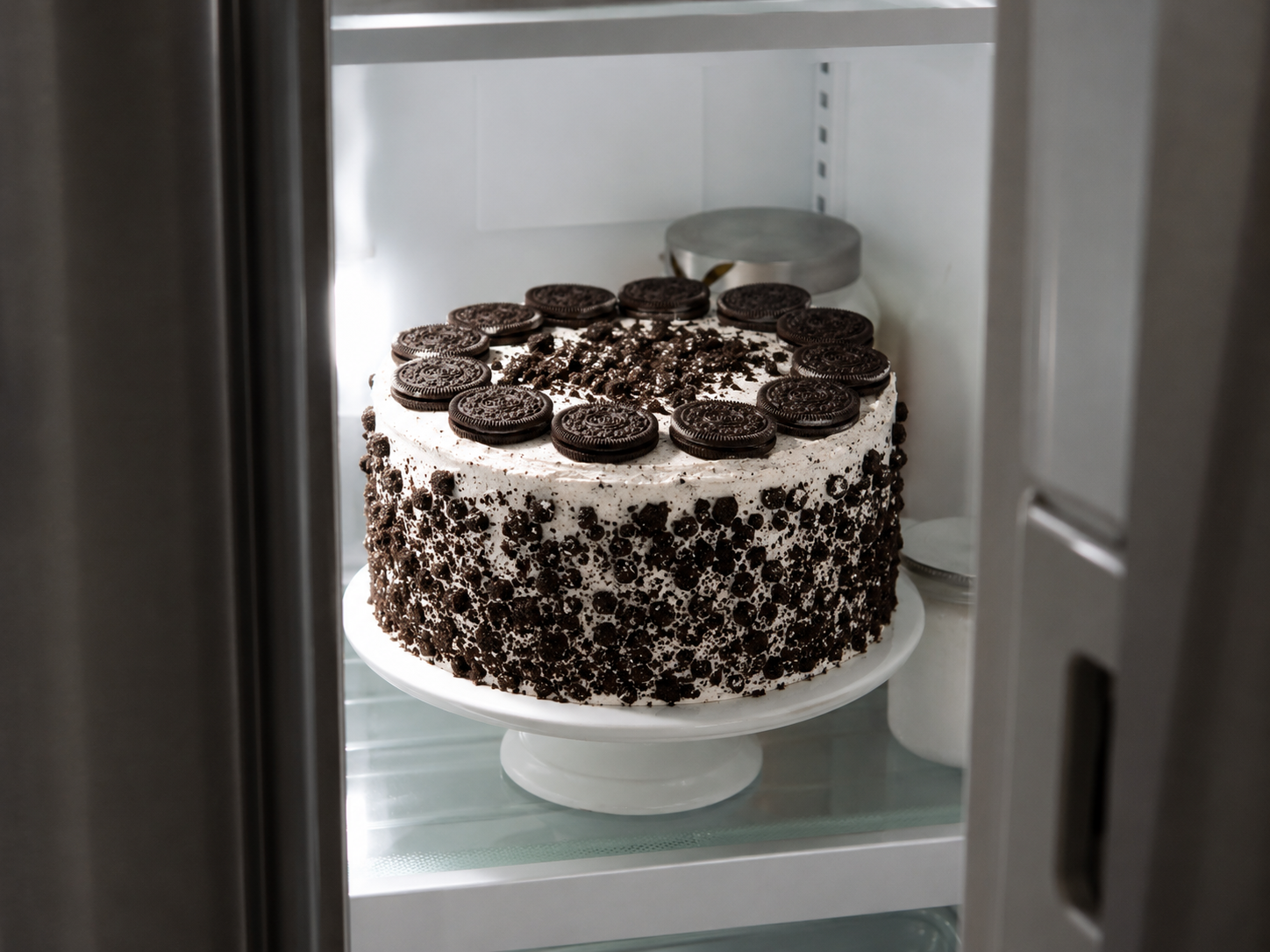 Finished Oreo cake chilling in the fridge — fully assembled and decorated, ready to set