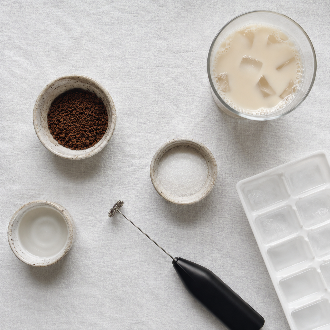 All cloud whipped coffee ingredients: instant coffee, sugar, hot water, milk and ice