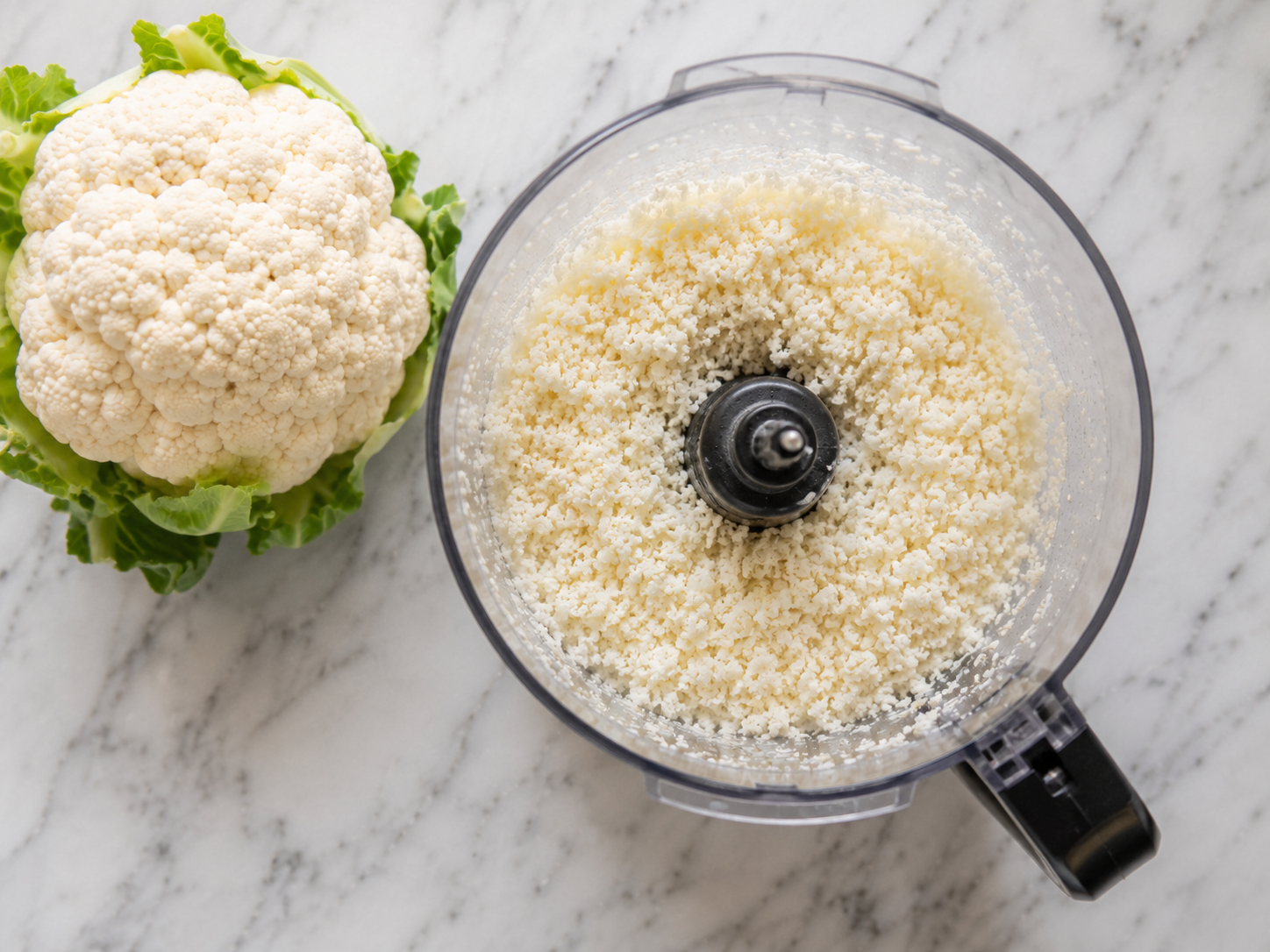 Cauliflower florets pulsed in a food processor into fine rice-like pieces