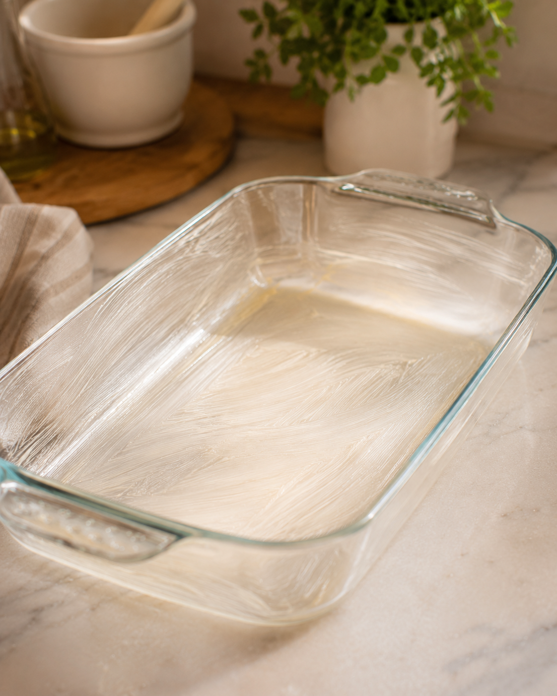 Greased 9x13 baking dish ready for the lasagna layers