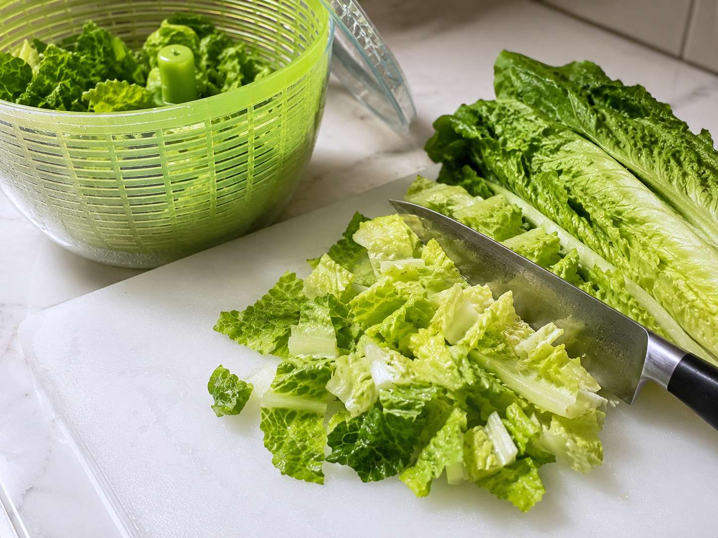 Romaine lettuce chopped into bite-sized pieces and dried thoroughly — crisp, cold and ready for the bowl