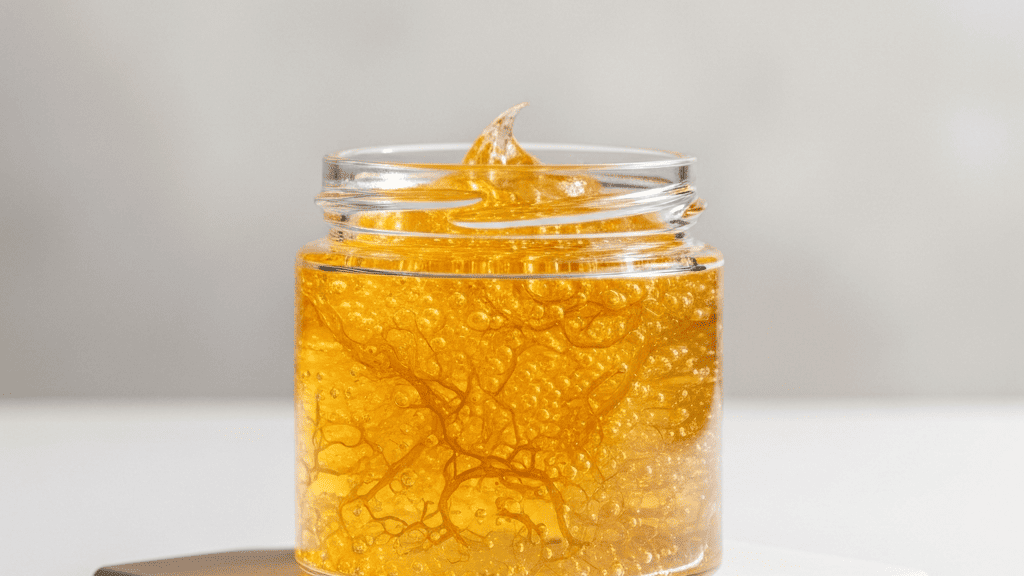 A jar of sea moss gel on a counter, mostly untouched