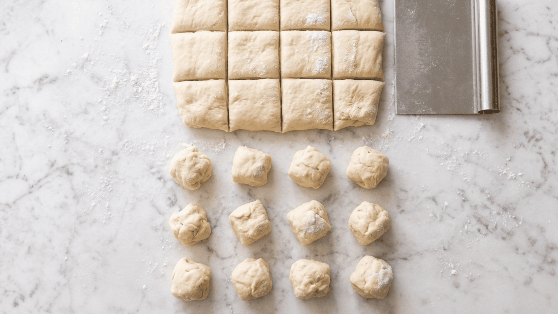 Dough cut into a grid and rolled into small balls for monkey bread